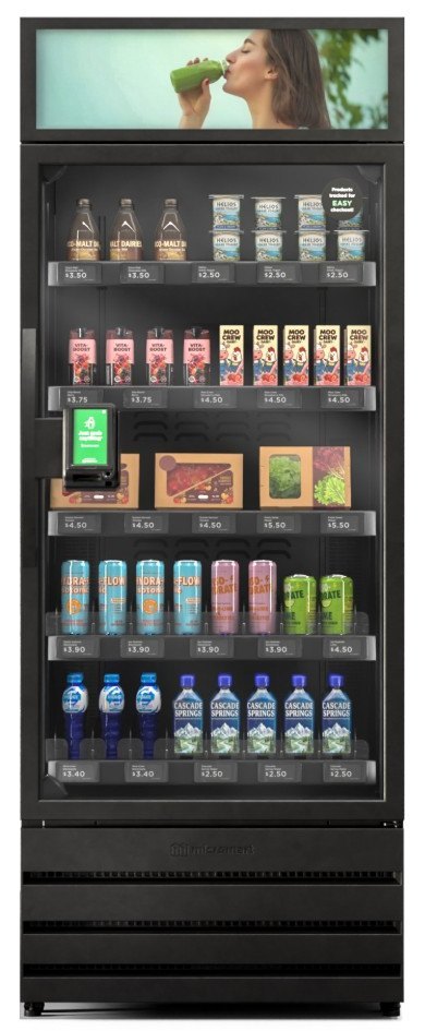 One door of the market, front on: display screen at the top, payment touchscreen on the door, a price label on every shelf